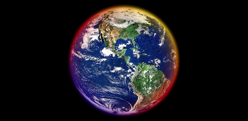 Full view of the entire Earth from space with a reddish glow around parts of it